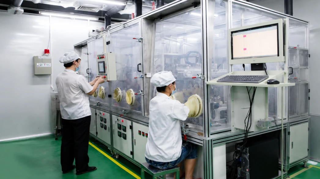 Automatic electrolyte injection machine with glove box system used for lithium-ion pouch cell electrolyte filling in battery manufacturing.
