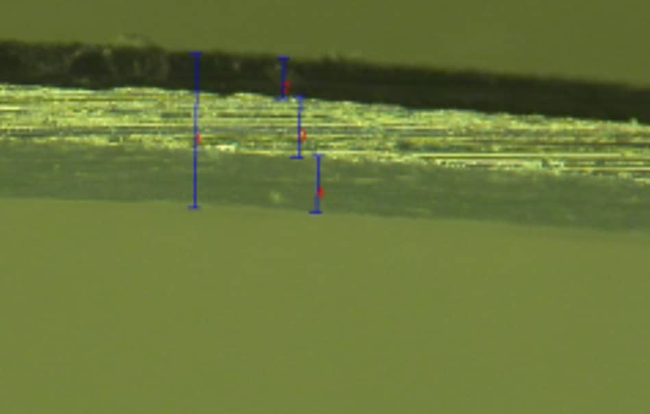 Cross-sectional microscope image of lithium-ion pouch cell aluminum laminated film showing the nylon layer, aluminum barrier layer, and PP heat-sealing layer with measured layer thicknesses.