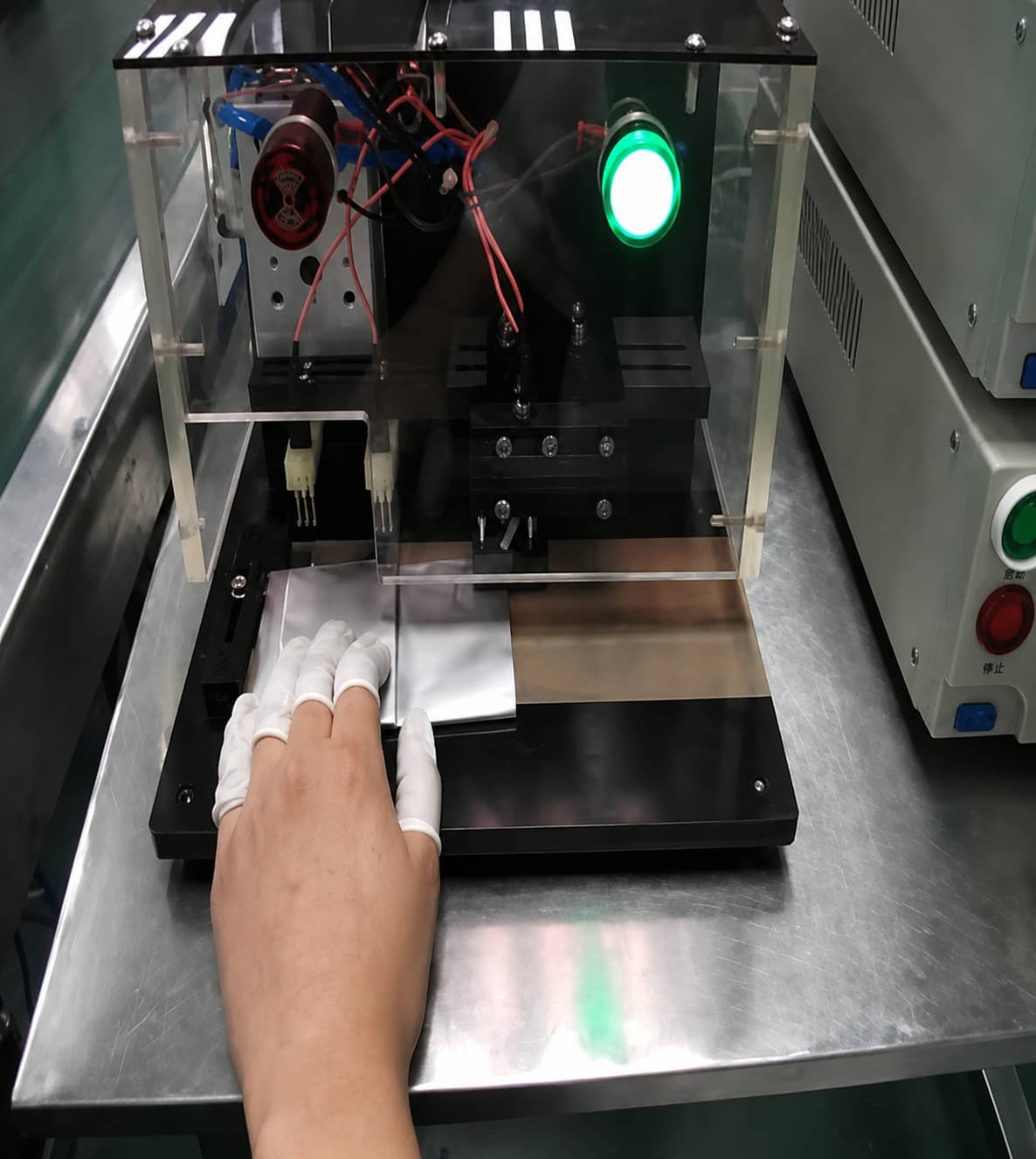 Three-in-one pouch cell testing machine performing internal resistance measurement and insulation screening after lithium-ion battery sealing.