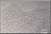 Hard carbon TEM micrograph showing tangled and disordered carbon layer structures with low graphitization degree for battery anode applications.