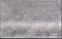 Soft carbon TEM micrograph showing partially stacked ordered carbon layers with higher graphitization degree compared with hard carbon anode materials.