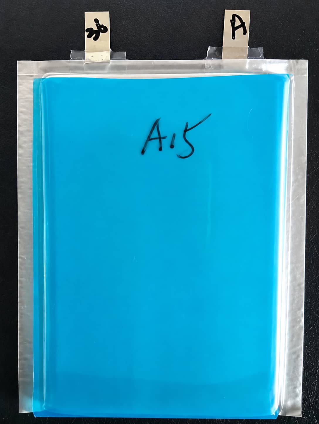 Lithium-ion battery electrode binder adhesion test showing stable bonding to aluminum or copper foil after long-term electrolyte soaking, with no visible peeling in the tested sample.