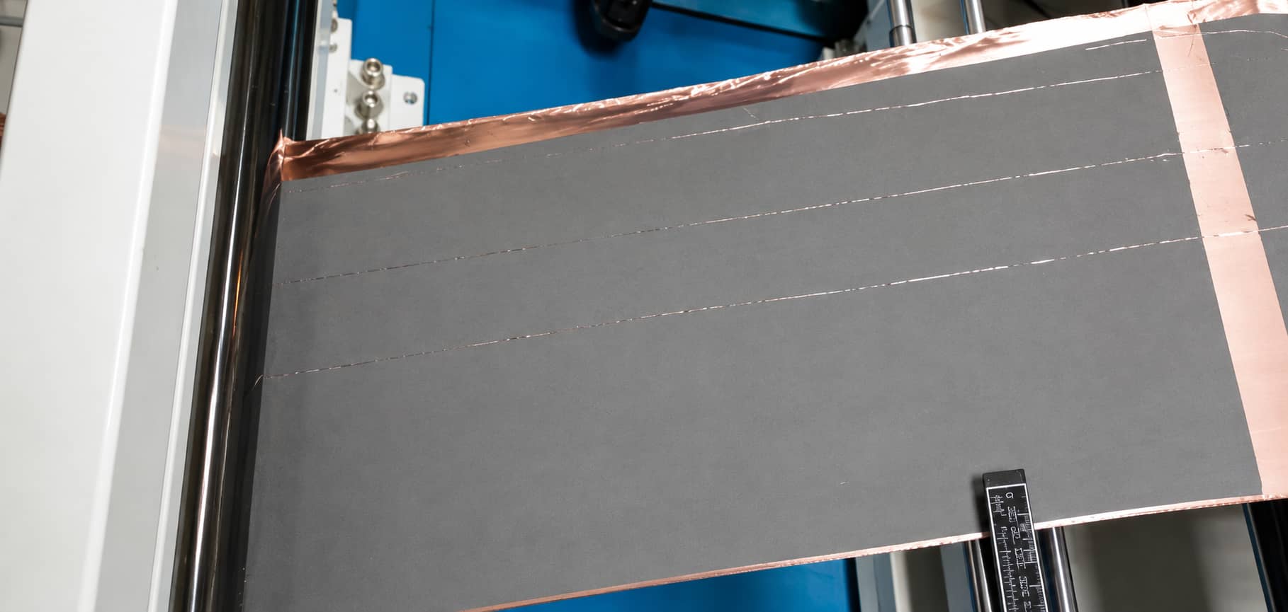 Electrode coating streaks and non-uniform coating observed during CANRD novel binder pilot-line scale-up trials, illustrating a historical slurry coating process defect.